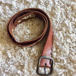 Brown Leather belt with hand sewed pattern.